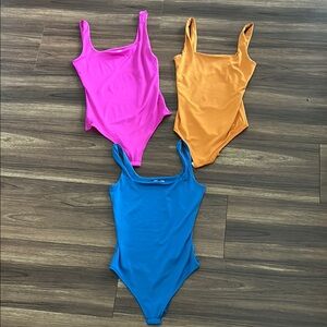 Stylish Pink, Orange, and Blue Bodysuits